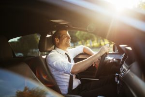 Close up of a Businessman driving a car